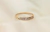 Anillo Cintillo Oro 18k medio sin fin con cubics blancos