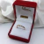 Anillo Cintillo Oro 18k medio sinfin con Cubics blancos y azules en internet