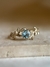 Anel Enchanted Trançado com Água Marinha e Ouro 18k