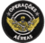 Patch bordado com o texto "Operações Aéreas", apresentando um soldado com asas e armas, em fundo preto.