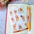 Cartela de adesivos do Ursinho Pooh com diversas ilustrações do personagem em diferentes poses