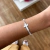 Pulseira Cruz Cravejada