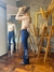 Calça Feminina West Tuff Flare Cos Alto Brilhos Cruz em Pedrarias c/ Elastano. na internet