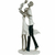 Escultura em poliresina de uma família, representando um pai, uma mãe e um bebê, com detalhes em branco e prata, medindo 35x16 cm.