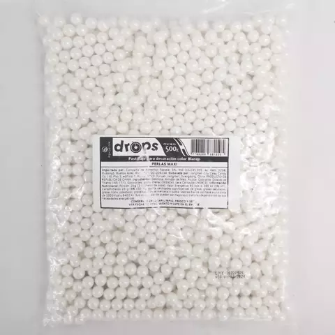 Pasta de decoración en forma de perlas blancas, presentada en bolsa de 500g.