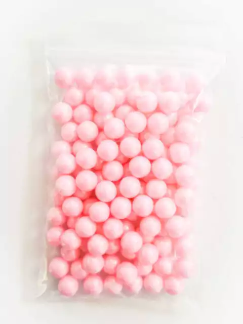 Paquete de perlas grandes color rosa de 50 gramos.