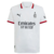 Camisa branca do AC Milan com detalhes em vermelho e preto, exibindo logo da equipe e patrocinadores.