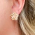 Brinco flor com zircônias cravejadas em banho de Ouro 18k - comprar online