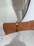 BRACELETE TREVO PRETO DOURADO AÇO - comprar online