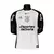 Camisa Corinthians I 25/26 branca com mangas pretas, logo do Corinthians no centro do peito e patrocínios Esportes da Sorte, Appgas e banco bmg