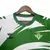 Camisa do Real Betis com design inspirado em Naruto, predominantemente verde, com detalhes em branco e logo da marca Hummel.
