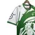 Camisa verde do Real Betis com design inspirado no personagem Naruto, destacando detalhes em branco e logotipo da marca hummel.