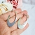 Brinco argola oval design lâmina G