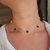 Choker trevo inspiração multiplos preto