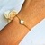 Pulseira trevo inspiração único madre perola