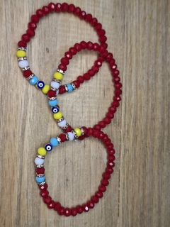 PULSERA ROJA OJO DORADO IMPORT en internet