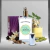 Frasco de perfume alternativo a KENZO - JUNGLE ELEPHANT de 50 ml, acompañado de ingredientes como flor de vainilla, clavo de olor y cardamomo.