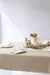 Mantel impermeable premium beige con dobladillo