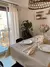 Mantel impermeable premium beige con fleco grande en internet