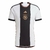 camisa-lancada-pela-adidas-para-a-copa-do-catar-2022-2023-selecao-alemanha-branca-com-risco-preto-no-meio-e-detalhes-em-dourado