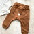 Conjunto body manga longa e calça na internet