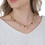 Colar corrente curto com canos e cristais dourado - comprar online