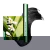Máscara de cílios Clarins Supra Lift & Curl em embalagem verde com textura preta ao fundo e flor branca com folhas verdes