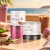 Combo Academia Nutrawell com suplemento Woman Protein sabor cacau e Creatina Pura sabor neutro em embalagens de pó sobre mesa com copo de bebida gelada