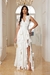 MAXI DRESS ESCOTE CRUZADO ABERTURA EN PIERNA Y OLANES