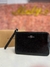 Wristlet negro efecto vinil coach