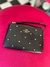 Wristlet negro con cristales dorados coach - comprar en línea