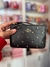 Wristlet negro con cristales dorados coach