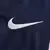 Detalhe do swoosh da Nike na camisa titular home PSG I 2024/2025 azul e vermelha masculina, versão oficial e original, Paris Saint-Germain, uniforme de futebol, logotipo Nike branco, efeito pinceladas, estilo urbano, alta qualidade, clube francês, Paris, 