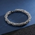 Pulseira Cromada Trançada - Banho Prata - SLATT