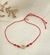 PULSERA MARGARITA HILO ROJO