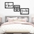 Quadro decorativo com as palavras "Amor", um coração estilizado e "Gratidão" em um ambiente de quarto aconchegante.