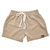 Shorts bebês em tom bege com elástico na cintura e cordão de ajuste.