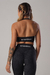 top feminino academia costas abertas