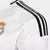 Camisa branca do Real Madrid, modelo 24/25, da Adidas, manga longa, para torcedores masculinos.