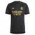 Camisa III do Real Madrid 23/24, modelo masculino, na cor preta, com detalhes em dourado e logo da Adidas.
