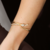 Bracelete de Nó Cravejado em Zircônia Semijoia Ouro 18K - comprar online