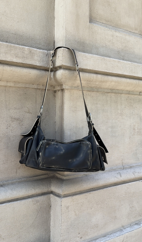 Cartera Reggio gastada