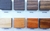 Muestras de diferentes tipos de madera para comederos de mascotas, incluyendo negro, nogal, roble, petiribí, cristal, viraro, cedro y caoba.