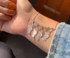 Colar coração + 4 bonequinhos
