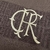 Camisa masculina do Flamengo "Novembro Negro" 2024, em tom marrom com detalhes em creme e logo do clube.