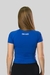 Camiseta de compressão feminina na cor azul, vista de costas, com logo "GYM LEGACY" na parte superior.