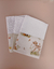 Trio de fraldinhas de boca brancas com detalhes em tecido estampado com desenho de cervo, flores e padrões xadrez