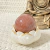 Introducing the Red Quartz Sphere - a symbol of passion and energy. This meticulously crafted sphere is more than just decoration; it represents vitality and spiritual elevation. Perfect for those seeking inspiration and emotional balance.
