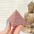 Red Quartz Pyramid - An Inspiring Addition for Passionate Souls and Tantric Enthusiasts Seeking Natural Beauty and Positive Energy in Their Space. Whether you're a creative seeking inspiration or a practitioner of the tantric arts, the Red Quartz Pyramid 
