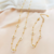 Conjunto Gargantilha e Pulseira Flor de Contas Brancas na internet